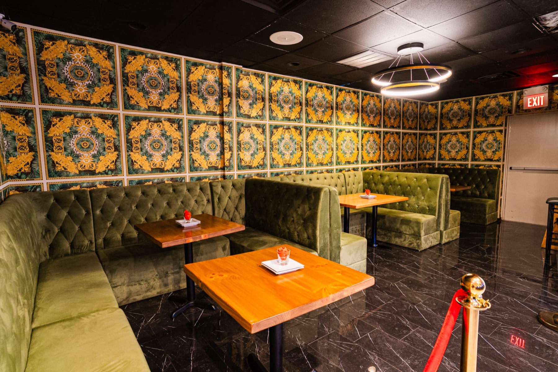 Green dining booths and tables inside Shebelle